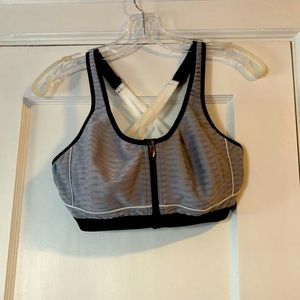Victoria’s Secret sports bra. Brand new. Never worn. Underwire and zip front.